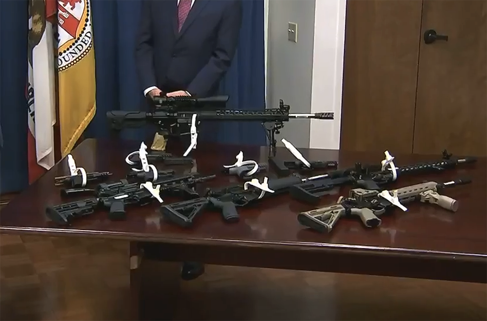 ghost gun polymer80 pistols on a table with AR-15 rifles